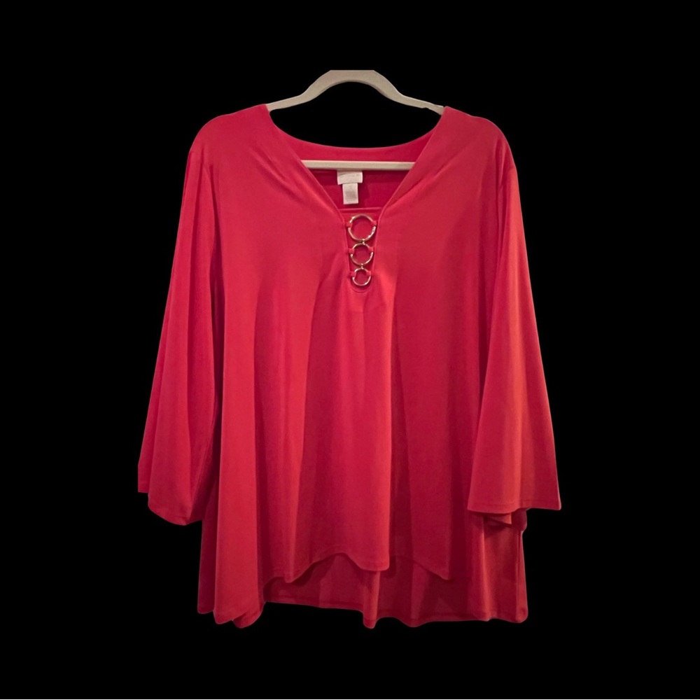Chicos beautiful orange slight bell sleeve top with gold accent circles.